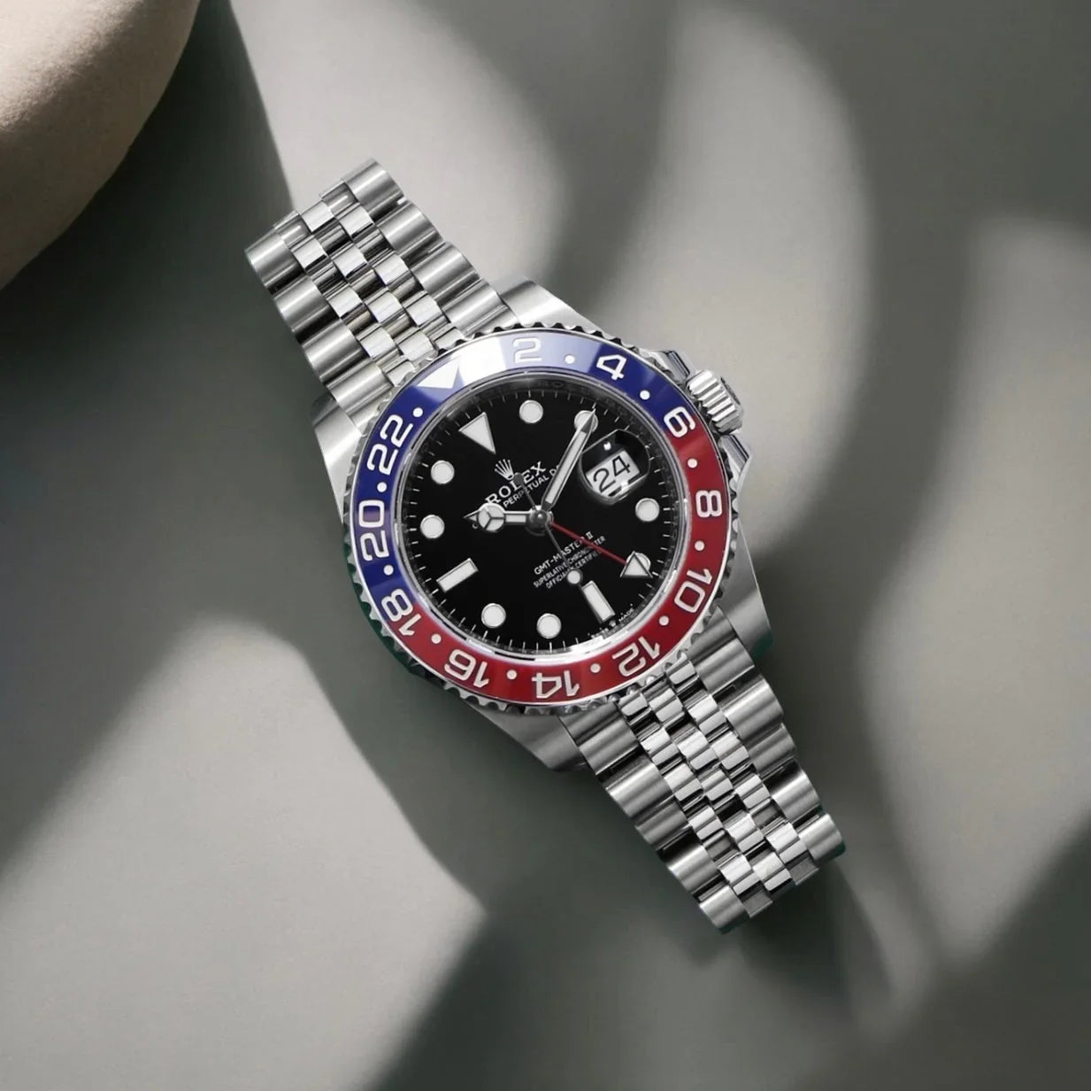 ROLE_X GMT-Master II red and blue Cerachrom bezel black dial and a Jubilee bracelet.