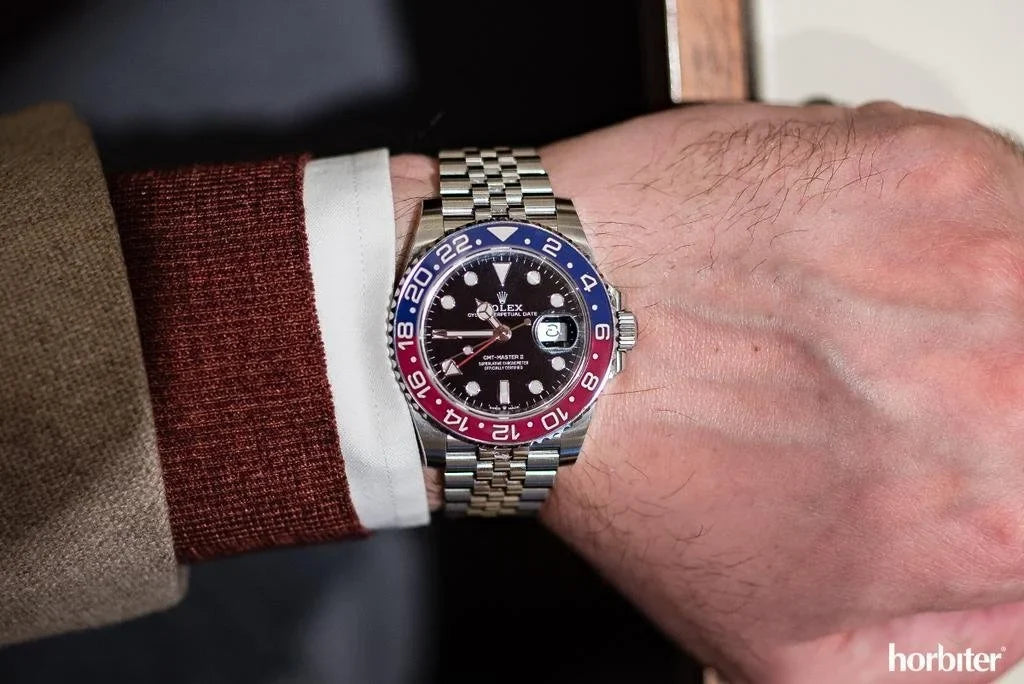 ROLE_X GMT-Master II red and blue Cerachrom bezel black dial and a Jubilee bracelet.