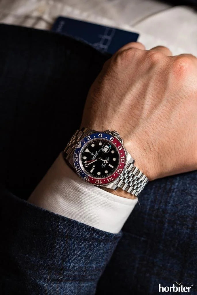 ROLE_X GMT-Master II red and blue Cerachrom bezel black dial and a Jubilee bracelet.
